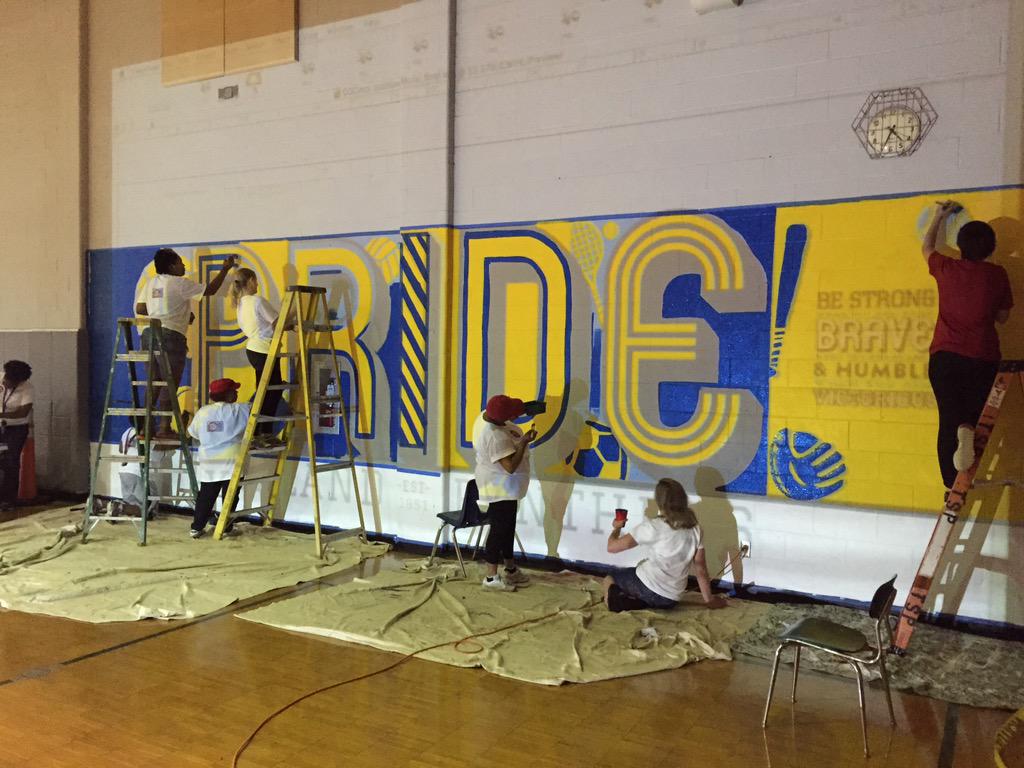 Members of Crossroads Church sponsoring GO CINCINNATI projects all over the city, painting mural and playground games