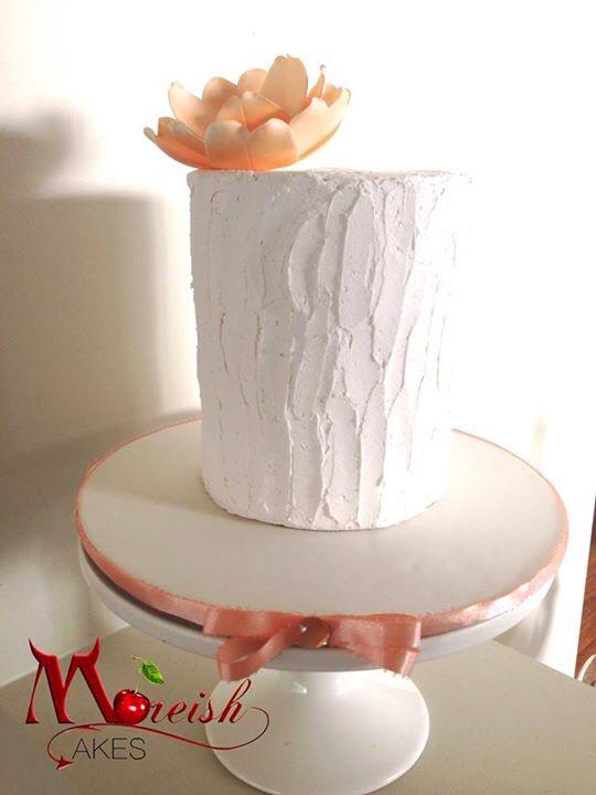 Moreish's tweet photo. The wildly popular "Anika" cake - lashings of mashmallow butter cream frosting hiding a divine strawberry swirl cake http://t.co/uFm8wggwZB