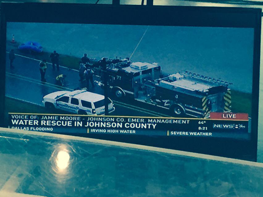 HAPPENING NOW: Crews in Johnson Co. trying to rescue family in home surrounded by flood waters.