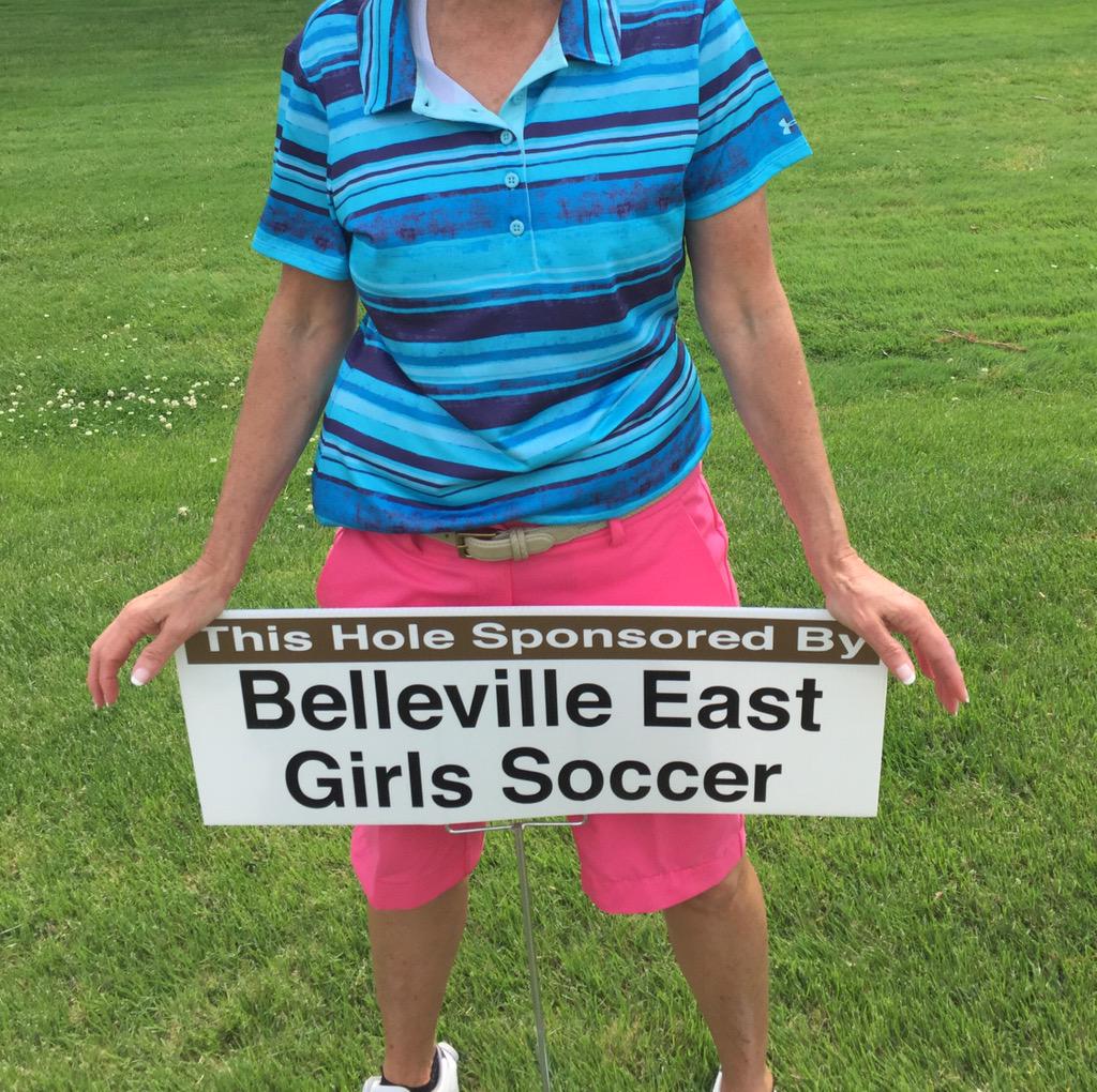 A proud supporter holding our sign at the boys golf tourney! #neverendingsupport #lancerpride ⛳️⚽️💙