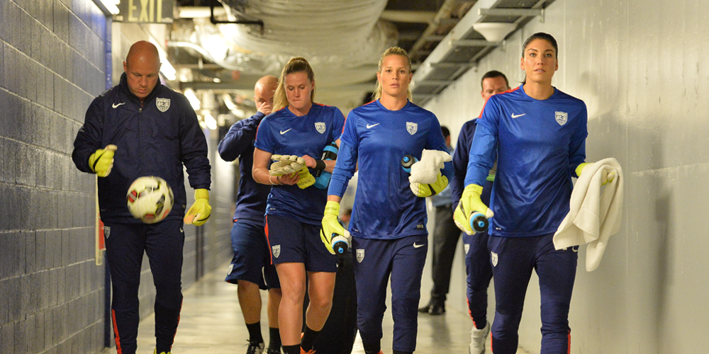 Goalkeepers on their way to the field.