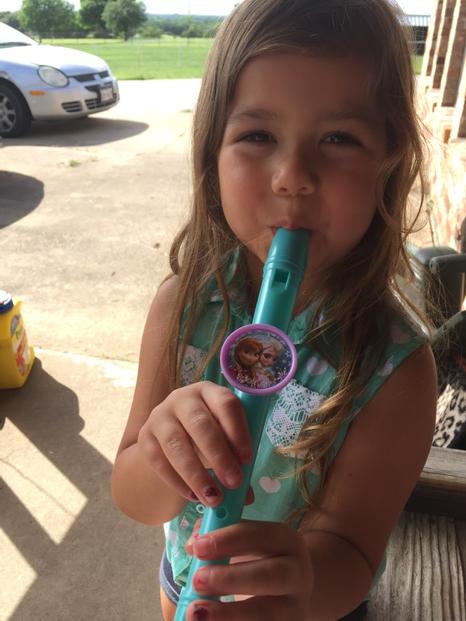 Lil natives love flutes too. That's a momma's house toy.