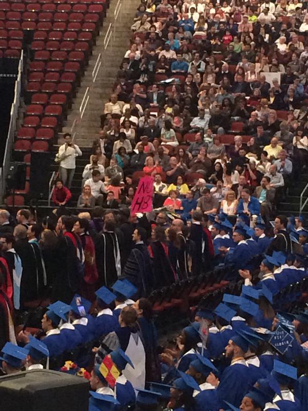 NOH8Campaign's tweet photo. LIVE: Professor displays #NOH8 sign @ #SetonHall2015 graduation after priest is allegedly fired for supporting #LGBT. http://t.co/fuVMlBaQ52