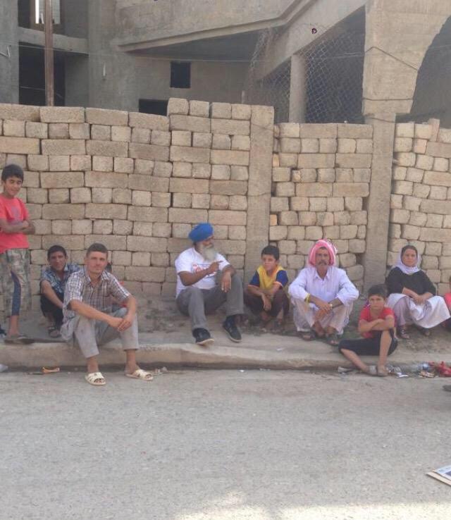 Khalsa_Aid's tweet photo. The CEO and founder of @Khalsa_Aid spending time with refugees in Iraq to understand their needs. #KA @RaviSinghKA http://t.co/x0jrcUk5Jt