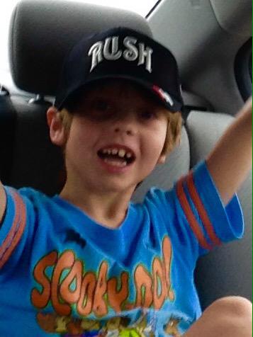 RayCoopTeacher's tweet photo. My son Rush wearing his new #RUSH cap from last night's Dallas Rush concert. @rushtheband #R40DAL http://t.co/2ws0yBTeZC