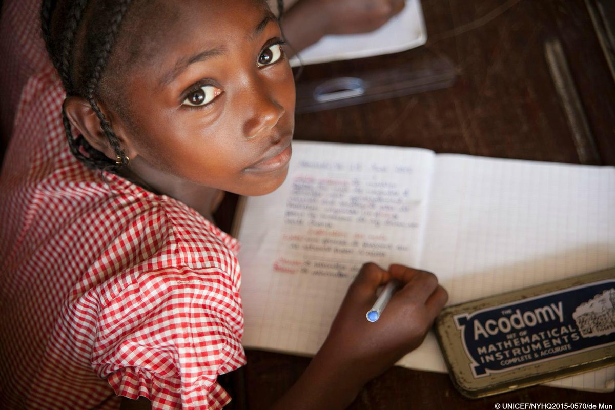 UNICEF's tweet photo. #PhotooftheWeek: A girl in class in #Guinea. Schools there reopened in January after a 5-month break due to #Ebola http://t.co/6tSZEFxkdy