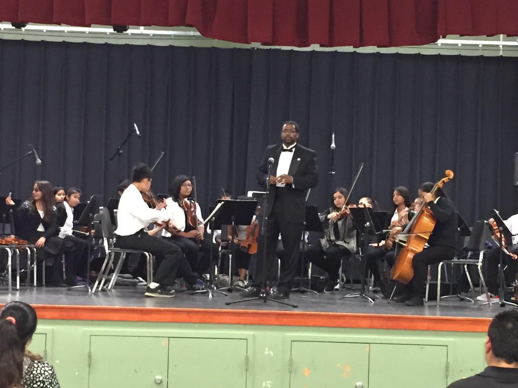 Teacher of the Year, Mr. Canser, getting the orchestra warmed up to play
