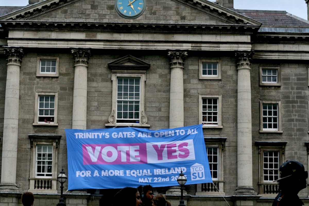 universitytimes's tweet photo. TCDSU hang Marriage Equality banner on College Green entrance without permission #marref http://t.co/IBCHeJ6vU3 http://t.co/t8ANdIfRB8