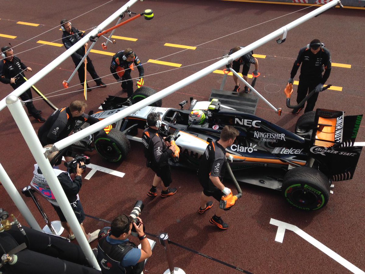 AstonMartinF1's tweet photo. Sergio returns from his install lap - he did go out on inters after all, the track still being damp in places. http://t.co/jCP9dsooCN