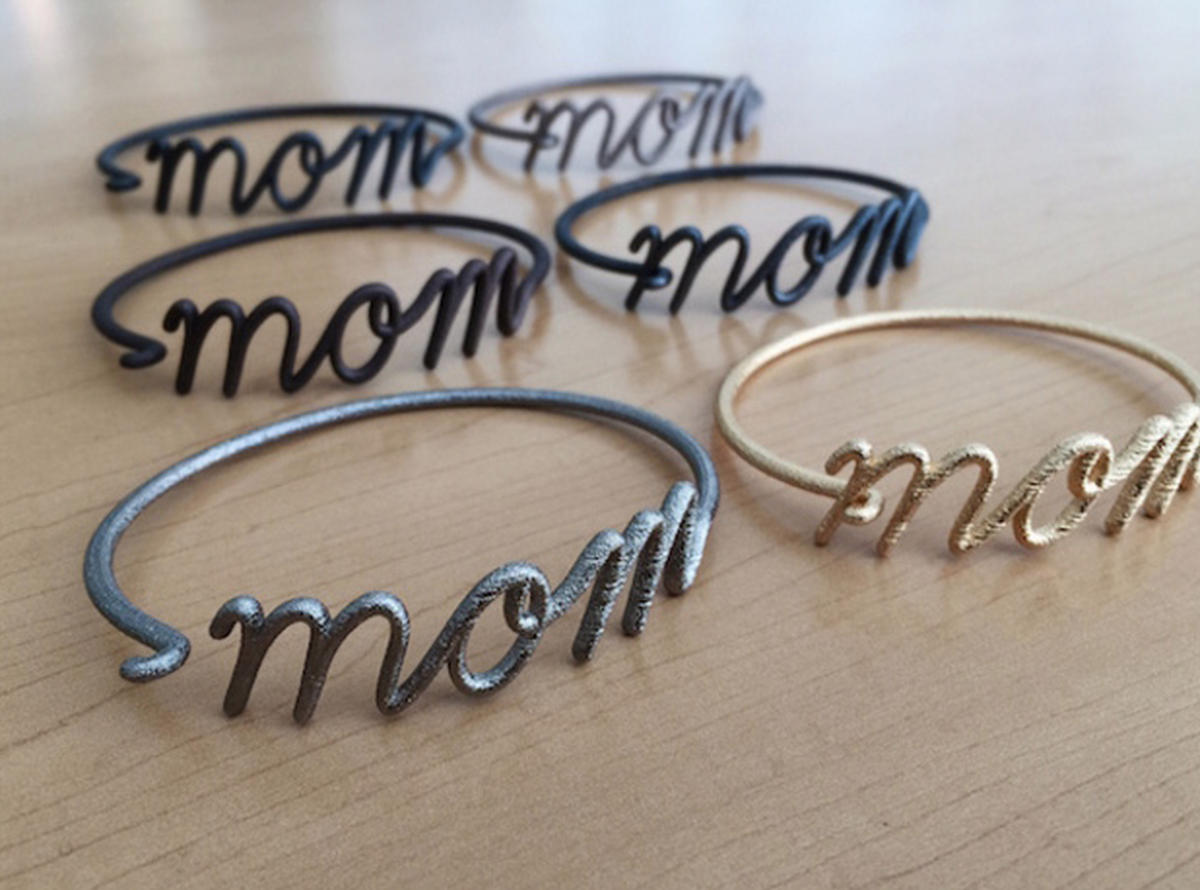 shapeways's tweet photo. Show mom some 3D printed love with a Mom Wire Bracelet designed by @3by3d: http://t.co/i77lyRsGt3 http://t.co/I9enM8tUmm