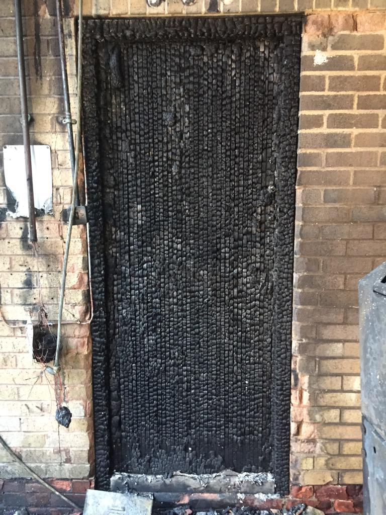 A24SohoFire's tweet photo. The importance of keeping fire doors closed. This is the same door showing one side badly damaged by fire #firesafety http://t.co/IxHA2tWmGI