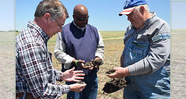 NRCS_Ohio's tweet photo. Dave Brandt shows Terry Cosby &amp; Tony Kramer his Soil sample w 1M Different Microbes http://t.co/oYvtfE5zUn @USDA_NRCS http://t.co/8Iw68y6STO