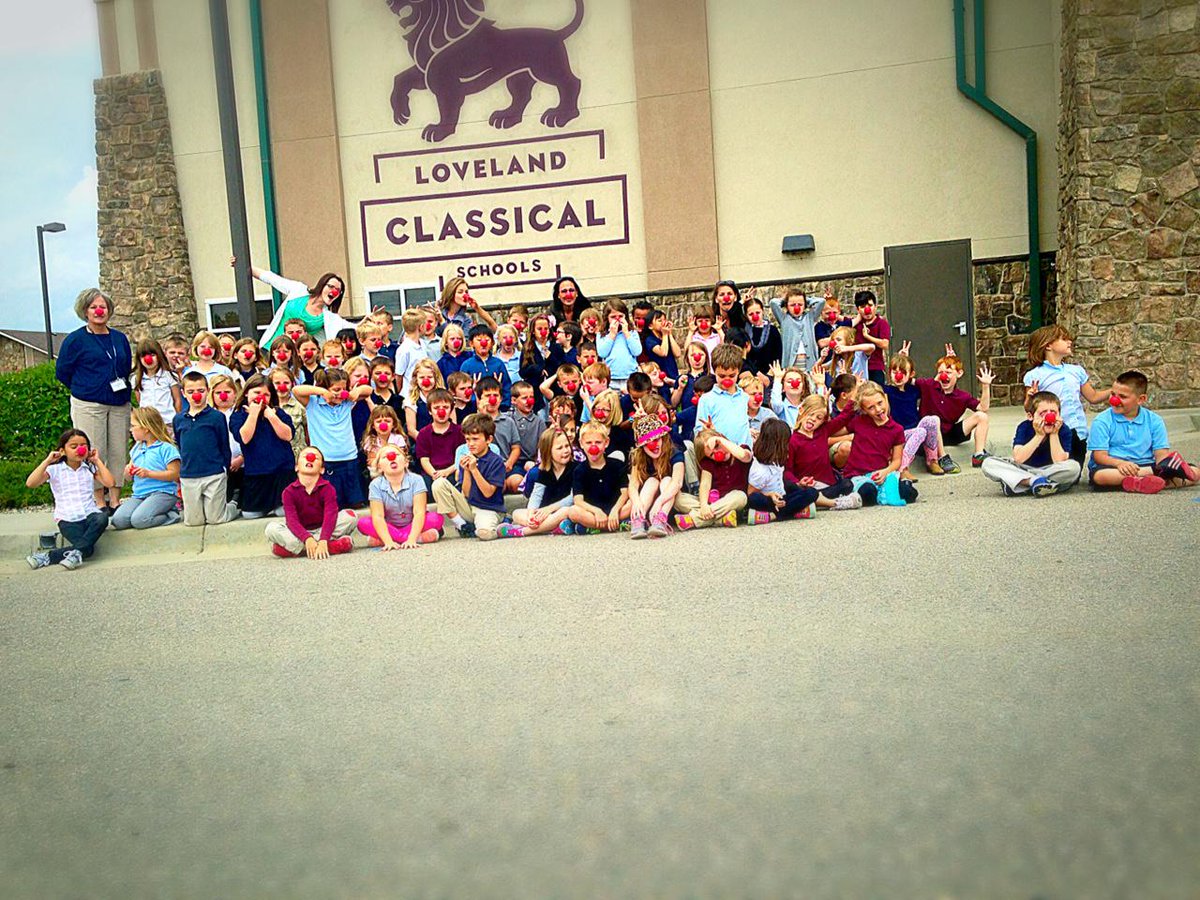 1st graders celebrated Red Nose Day and the end of the school year with a fun picture! #rednose #lovelandclassical