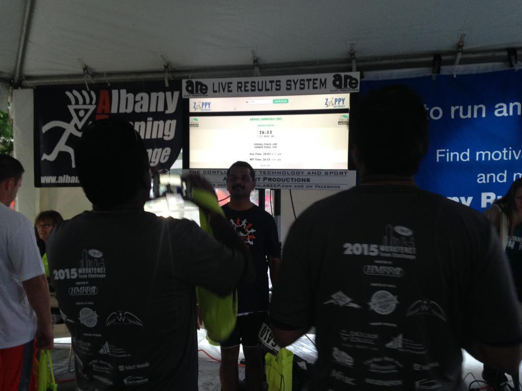 Runners checking out the live results! #WorkforceChallenge