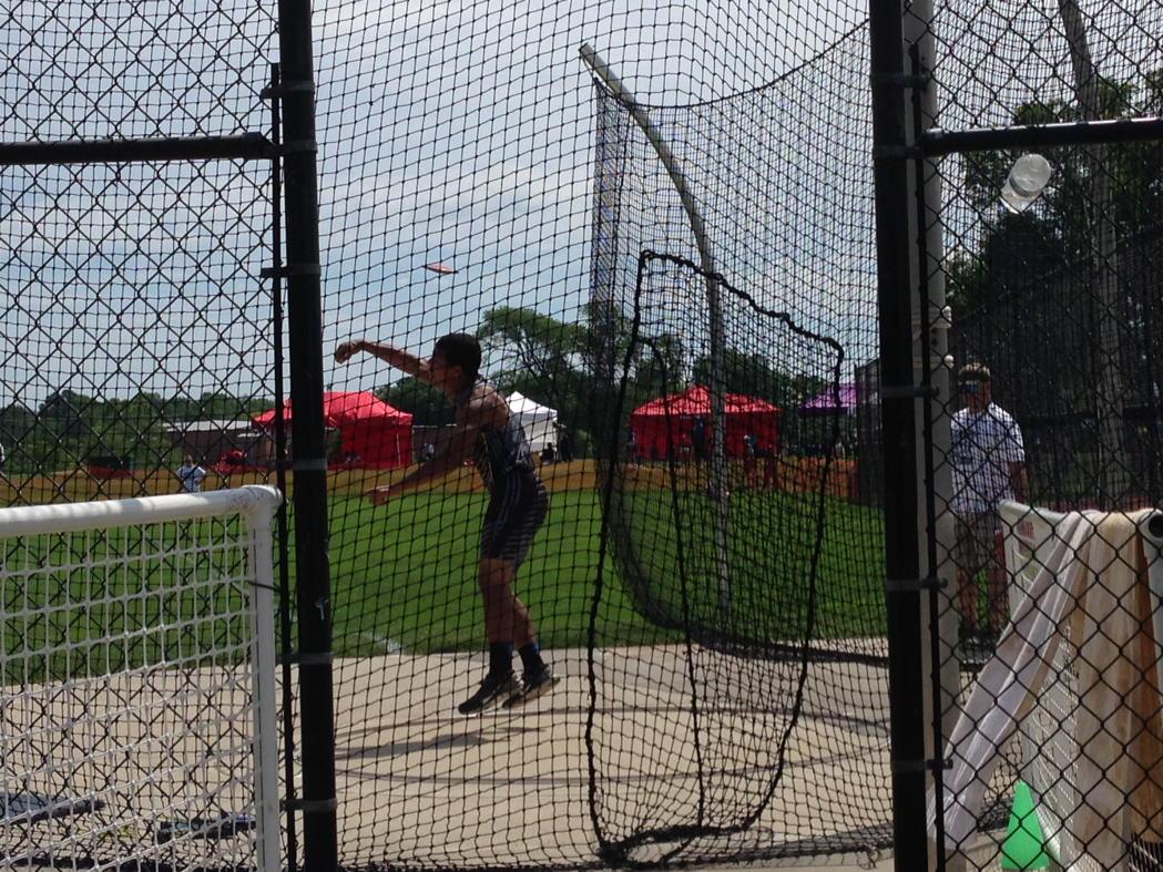 Brevin throwing discus at sectionals.