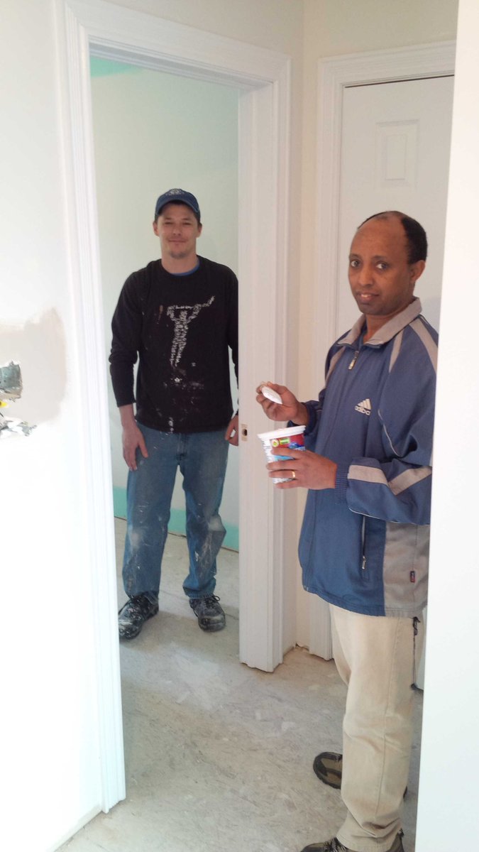 Volunteers putting on color <a href="/HClarenville/">Habitat Clarenville</a> Duplex Build Project.