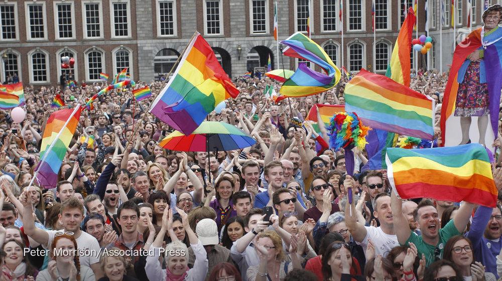 nytimes's tweet photo. Celebrating Ireland's vote to legalize gay marriage at Dublin Castle on Saturday  http://t.co/CfCpTUqjPp http://t.co/xUt8Wz6mgW
