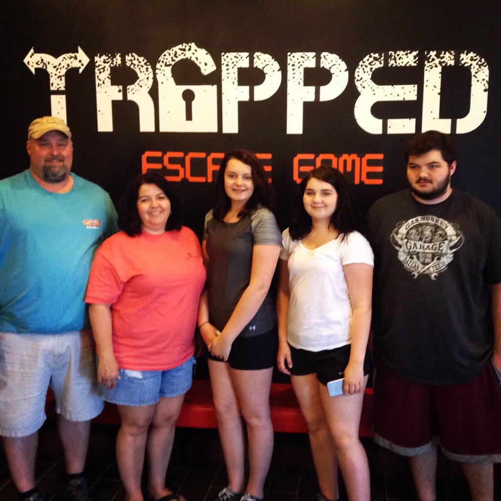 Trappedescape's tweet photo. This family from NC came so close to escaping White Lightning! Thanks for getting Trapped with us!#trappedescapegame http://t.co/s9OefeZaTz