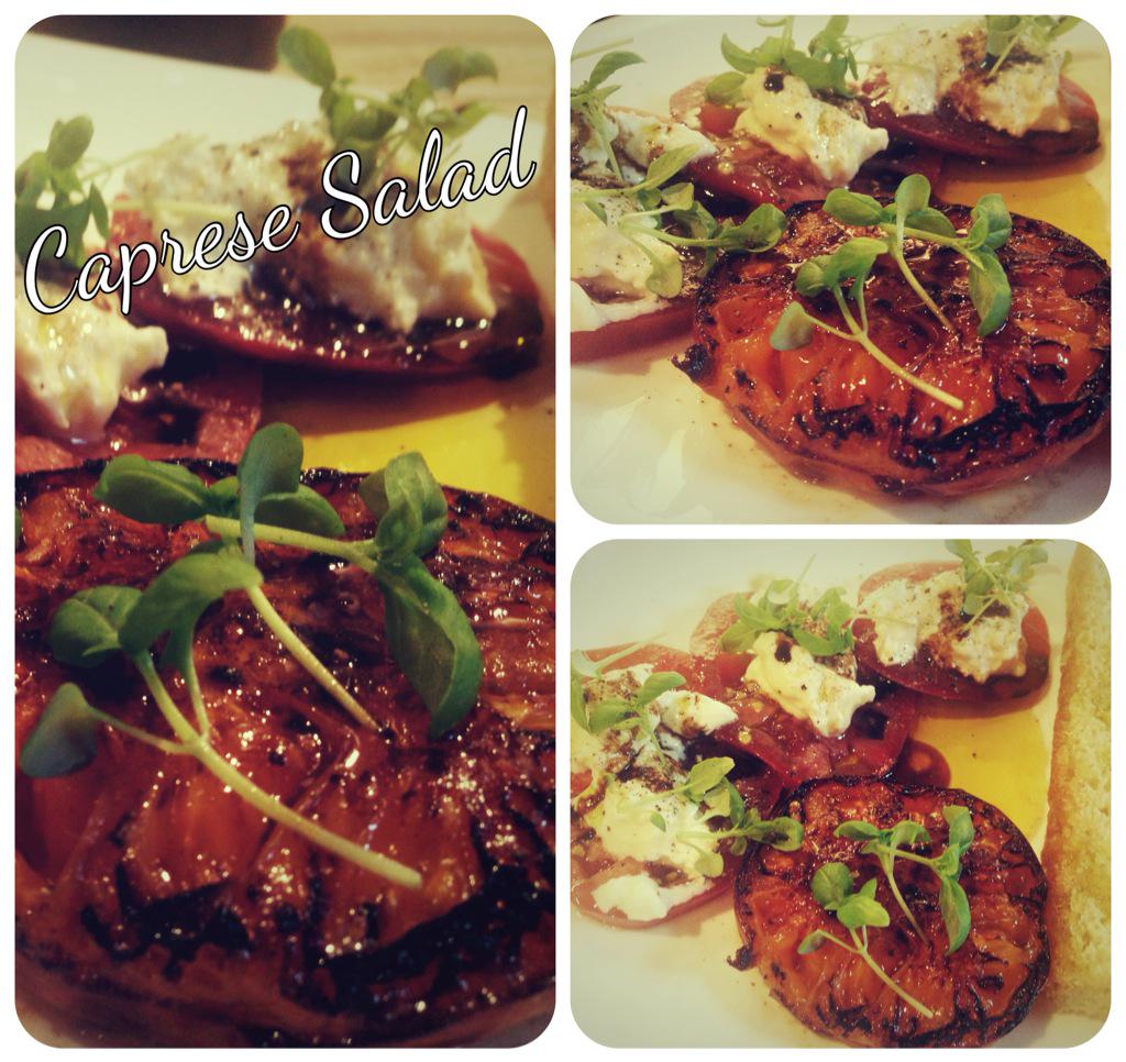 Heirloom tomatoes get the royal treatment and a kiss by the fire. #lastellananaimo #foodie #italian