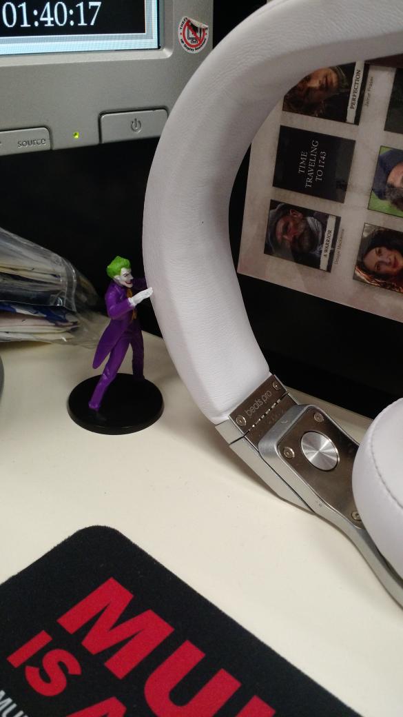 Joey_Rox's tweet photo. So I glance over and notice The Joker trying to make off with my headphones! #smh http://t.co/RiqUxqsdA6