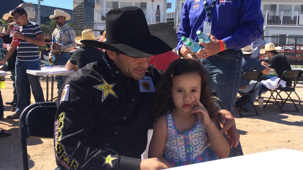 PBR's tweet photo. #LASTCOWBOY winner Joao Ricardo Vieira had a little help at this mornings meet and greet! #CowboySpringBreak http://t.co/6vfwrga29G