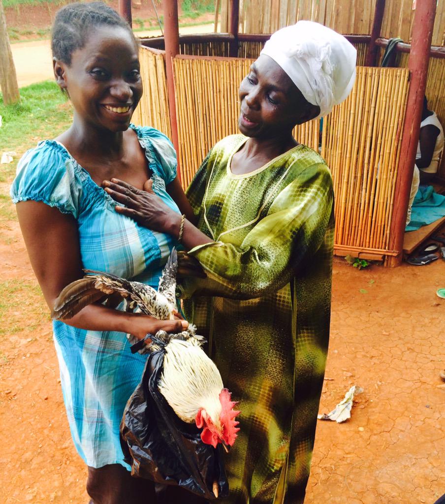 melissa_sevy's tweet photo. When you are gifted a *live* chicken-in-a-bag. #awkwardatwork #eoyslc #gala #EY #musana #uganda http://t.co/au8gSru7M6