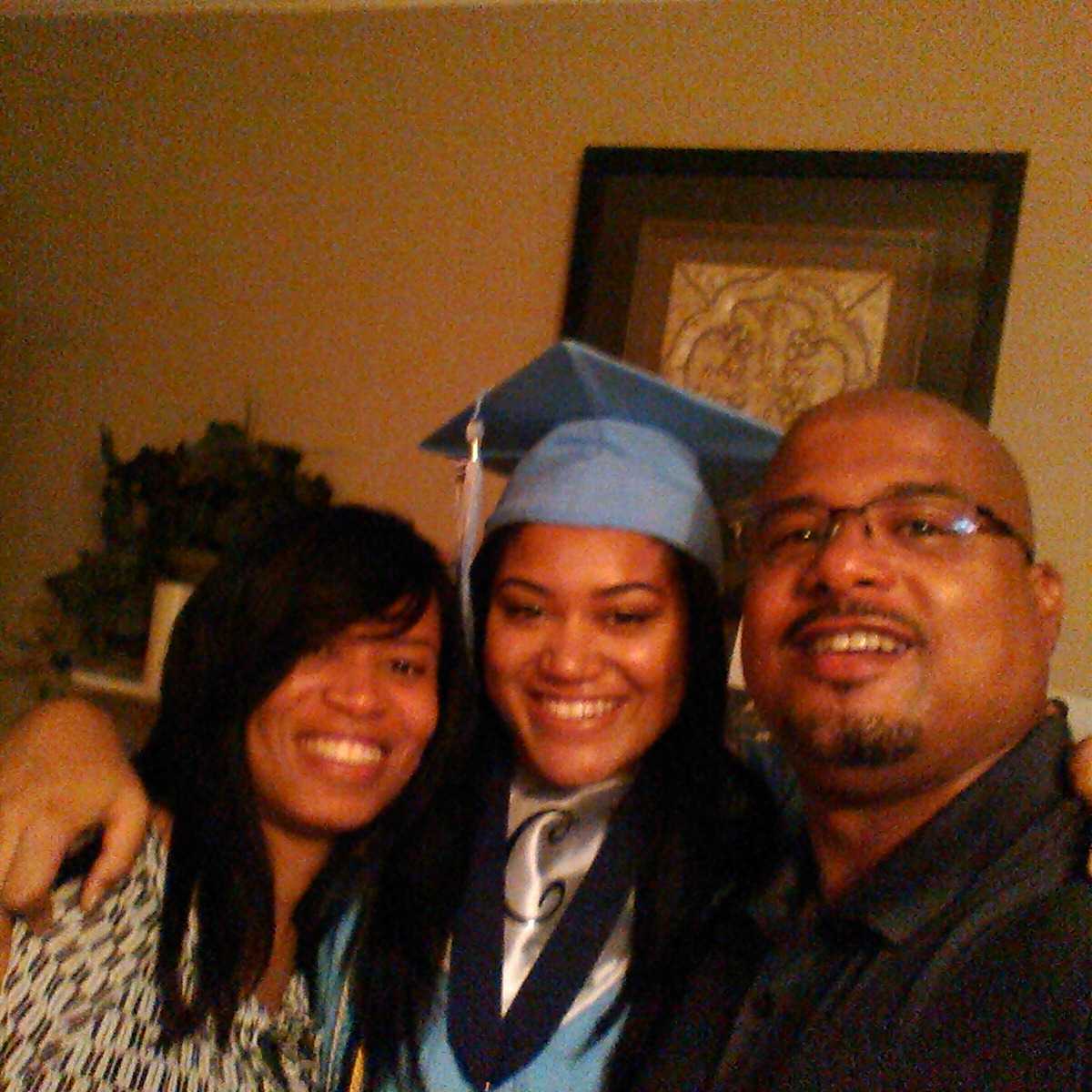 Graduation day with mom and day. Proud parents.