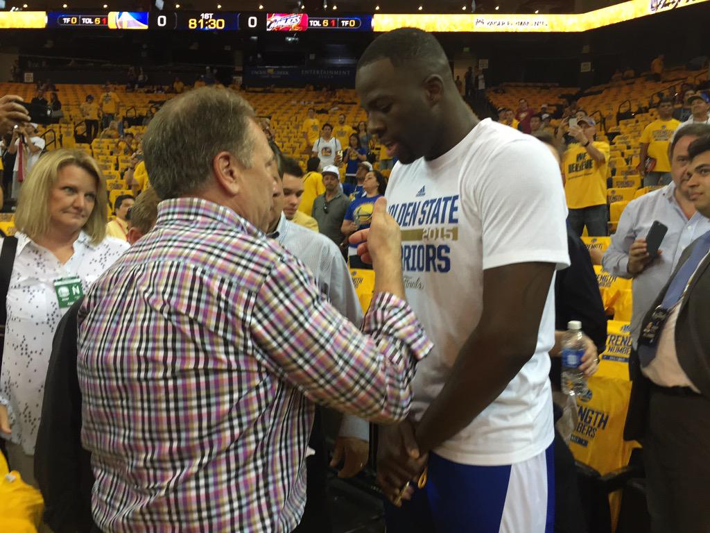 Draymond Green shares a moment with his former coach Tom Izzo.