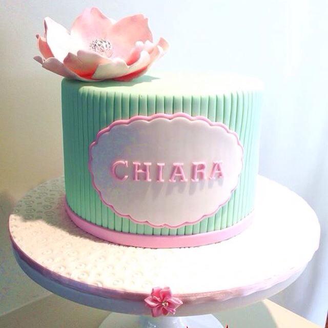 Moreish's tweet photo. Pretty christening cake for a very pretty little angel. Edible silver leaf in the flower. #moreishcakes http://t.co/eRudiBCckb