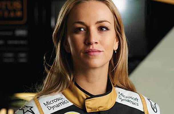   - Lotus F1 Team wishes happy birthday to Carmen Jorda by letting her touch the car\s steering wheel. 