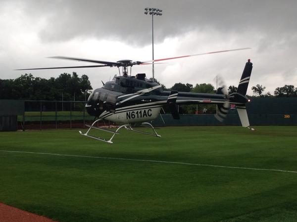 NCAABaseball's tweet photo. The rain in Dallas is no match for helicopters and an army of backpack blowers! 

via @DBU_Baseball #RoadToOmaha http://t.co/q9cYw44DD5