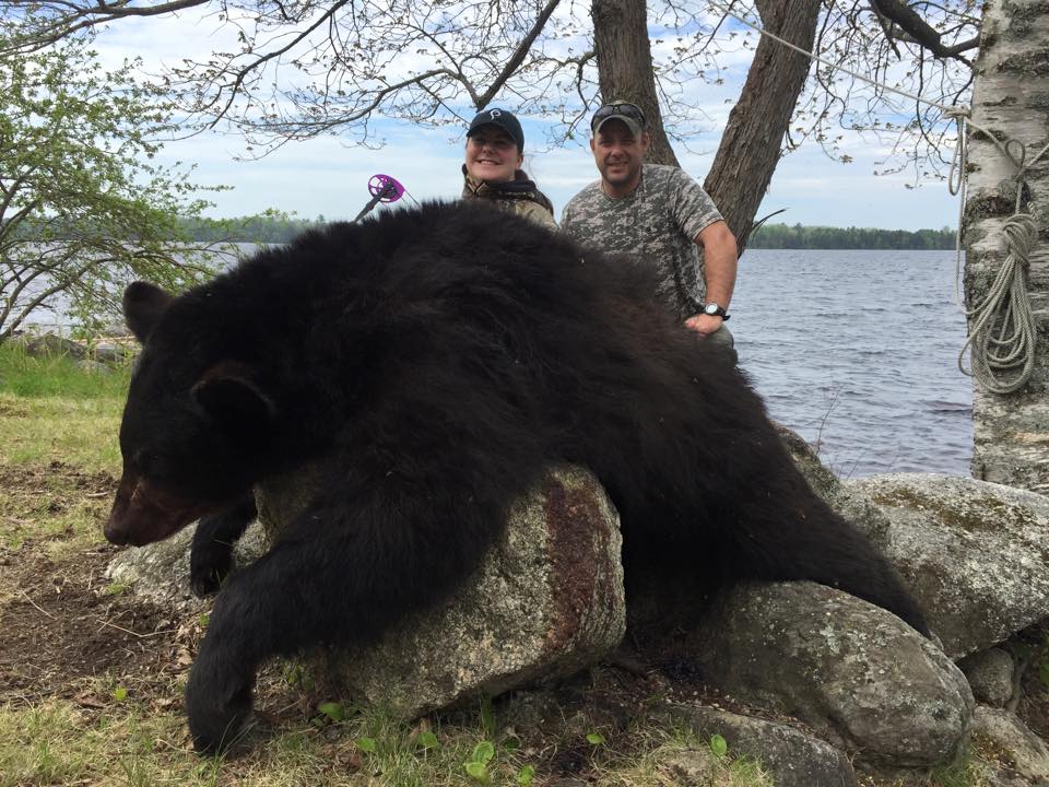 ProisHunting's tweet photo. Prois staffer Cristina McGannon with her first black bear taken on Tuesday night! #Proiswasthere #badasserydefined http://t.co/OnN7rTOIZz