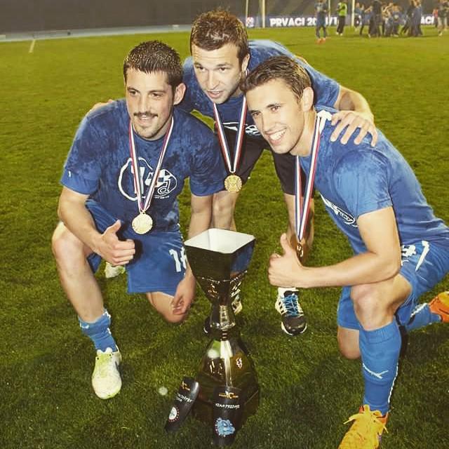Ademi and teammates with the trophy Ademi and teammates with the trophy