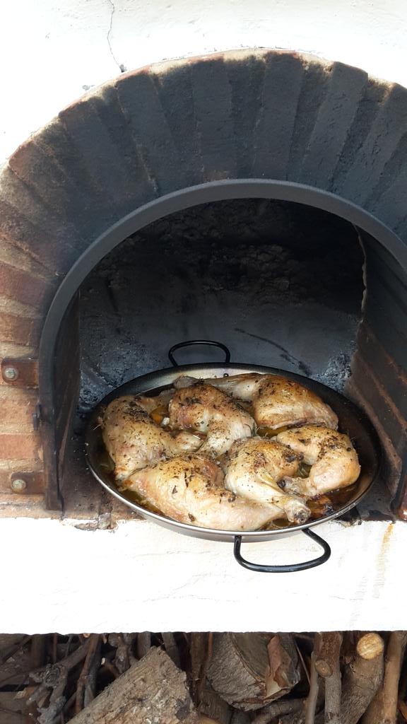 Chicken on a bed of fresh apricots and rosemary, cooking in a #pizzaoven is joy <a href="/HettiePotter/">Hettie Potter</a> <a href="/jamieoliver/">Jamie Oliver</a>