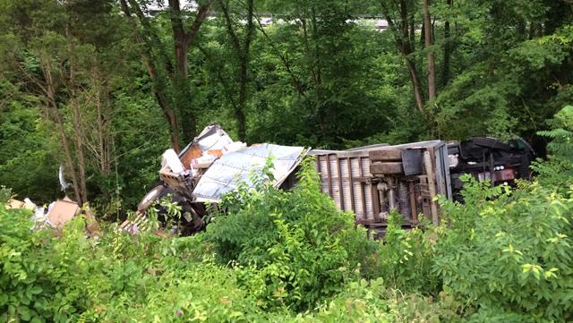 WKRN's tweet image. Semi overturns on I-40 West in west Nashville: wkrn.tv/1LUSahf