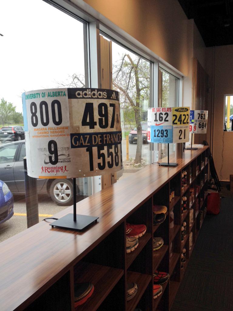 ReidCoolsaet's tweet image. Race number lamp shades at @StridesRunning. The best idea I've ever seen for old bibs.
