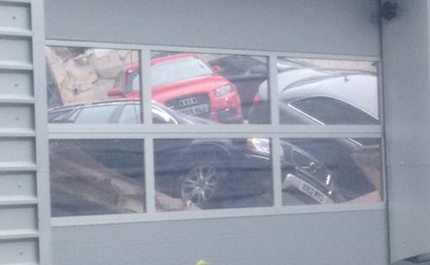 Telegraph's tweet photo. Audi roof collapse sends 20 cars crashing into Milton Keynes dealership http://t.co/phZbgjuX3y http://t.co/azNqEmexXD