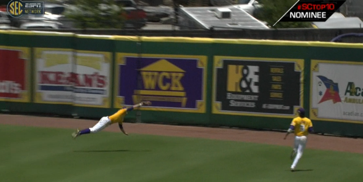 SECNetwork's tweet photo. It's a bird, it's a plane, no it's just @LSUbaseball 's A.Stevenson doing superman things. http://t.co/8Q2qRVTsvQ http://t.co/MyAoY5LdnW
