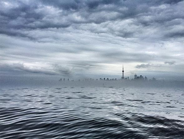 blogTO's tweet photo. #Toronto rises from the fog after the storm in our photo of the day http://t.co/CtzzptwggA #PhotoOfTheDay http://t.co/24CvSZEVRH