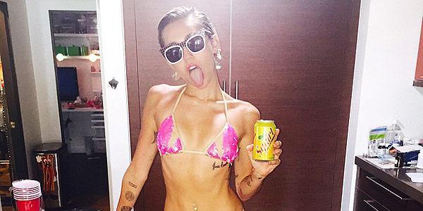 people's tweet image. What is @MileyCyrus up to in her itsy-bitsy pink bikini? (Besides flaunting her bikini bod) peoplem.ag/X2B1yMO