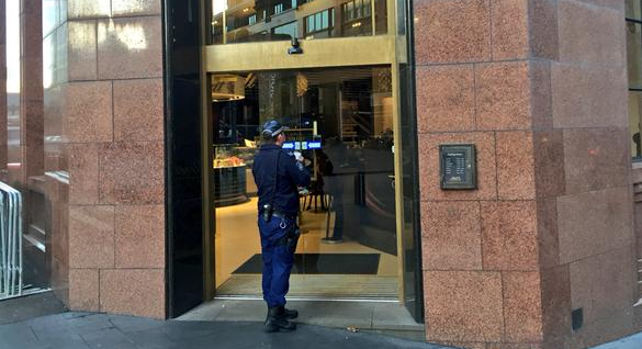 9NewsSyd's tweet photo. Police at Lindt Cafe in #MartinPl after rocks were thrown through the windows. Pic via @chrisurquhart. #9News http://t.co/HNqqWW95NY