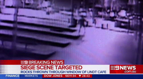 9NewsSyd's tweet photo. #BREAKING: Man in police custody following vandalism at Lindt Cafe in #MartinPl overnight. #9News http://t.co/WG5ptXpPWr