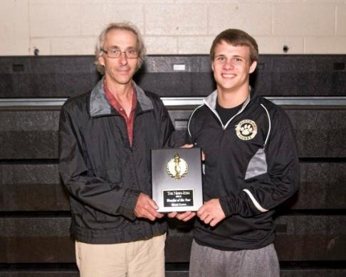 Kent Lane is presented w the 2015 News Item Wrestler of the year award by Chuck Souders of the News Item.