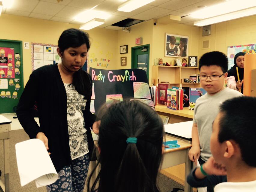 Grade 6s presenting their science projects on invasive species to Grade 3 students @JoycePS_Jr @watnunu