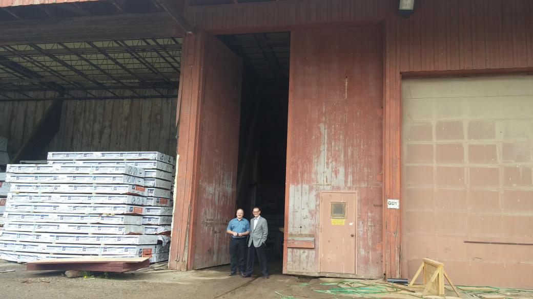 VHEDC's tweet photo. @EnterpriseMN Bob Kill and #structuralwood Pres standing by biggest door in @Vadnais_Heights http://t.co/d8jg9K7MrB