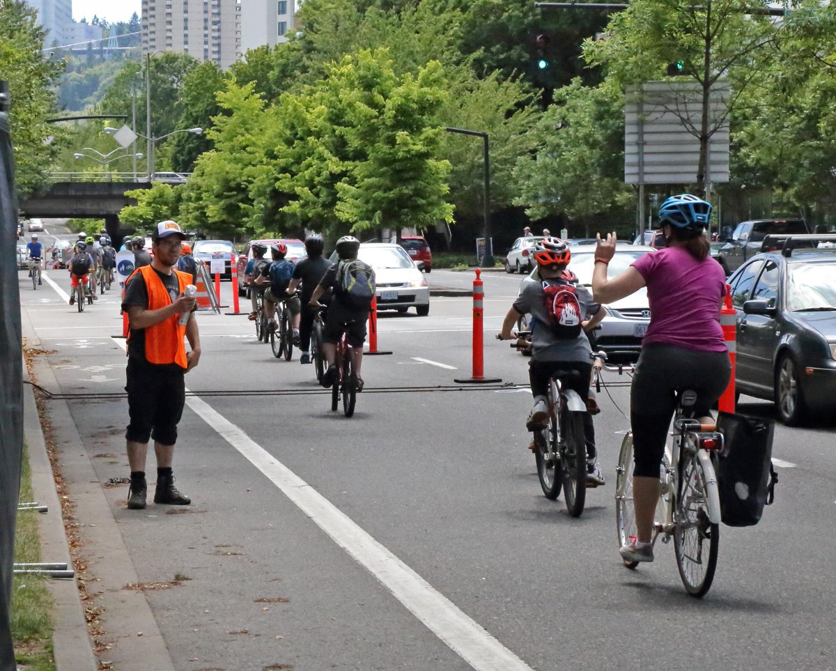 YesThatMountain's tweet photo. Pack of schoolkids overtake southbound #betternaito before it is even open! #betterblockpdx http://t.co/0dIRNk5KWU