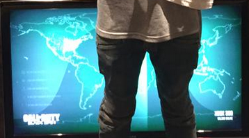 RealGamerAlert's tweet image. Black ops 3 multiplayer menu screen can be clearly seen behind @Tyga in this photo. Thoughts on design? #GamerAlert