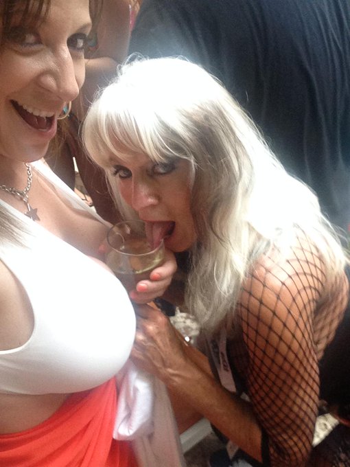 Naughty @SallyDangeloXXX drinking from my tits @xbiz #bikini contest #xbizsummit #Miami???? http://t