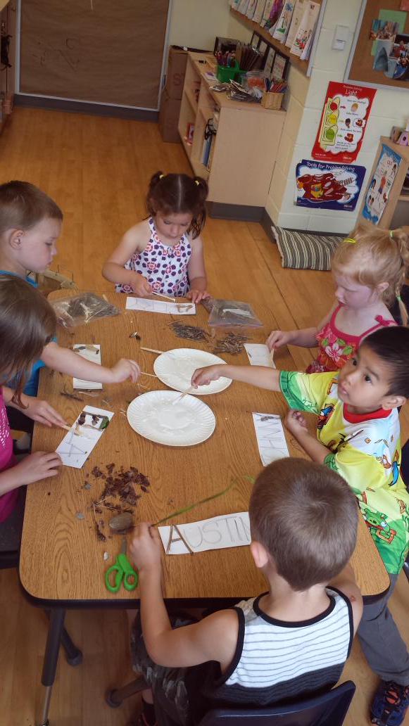 AlainaStandring's tweet image. Hard at work creating #naturenames today. Items collected yesterday during #outdoorlearning are being used.