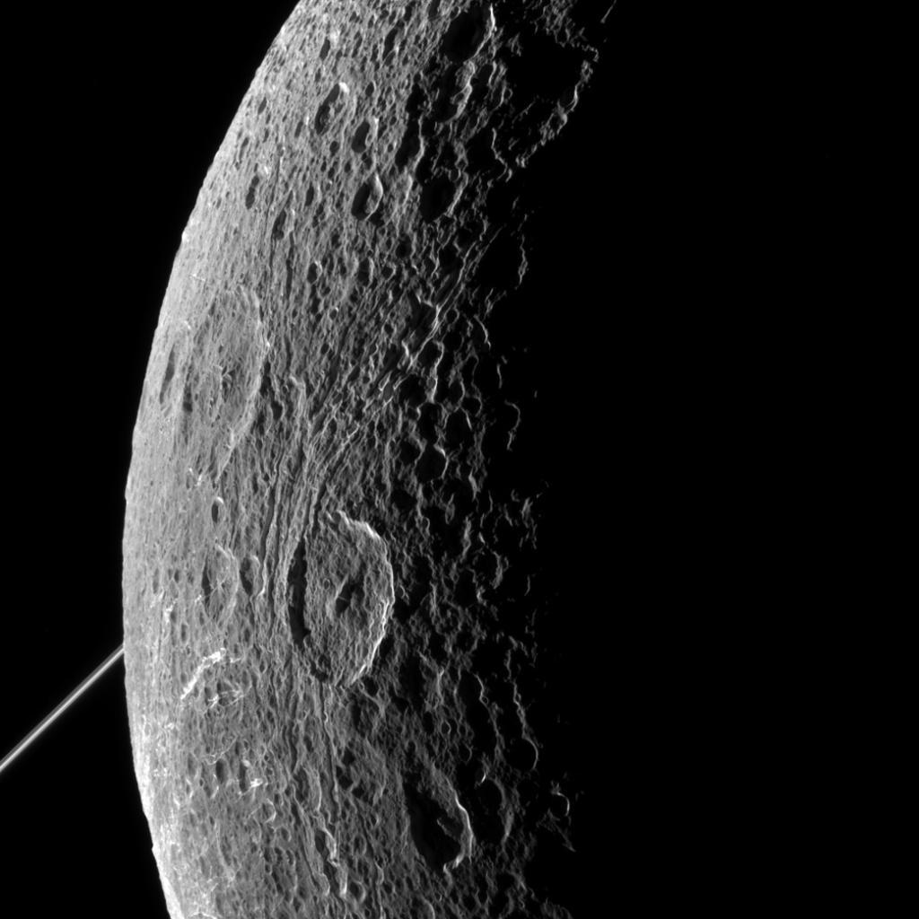 NASA's tweet image. Rugged landscape of Saturn's fracture-faced moon Dione revealed in new @CassiniSaturn images: go.nasa.gov/1Bo8eIc
